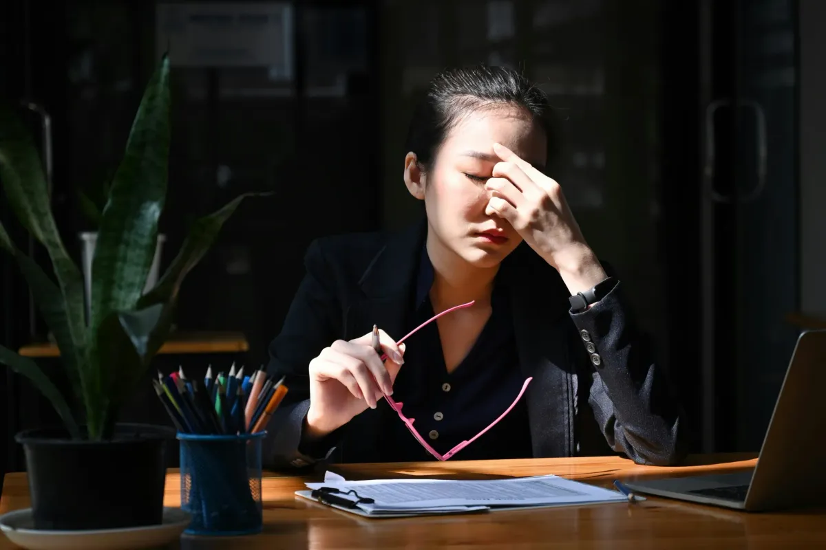 Balancing scales with work and relaxation symbols, representing burnout prevention strategies.